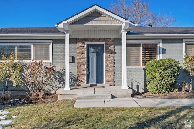 property entrance with a yard