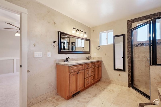 bathroom with vanity and an enclosed shower