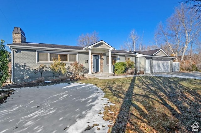 single story home featuring a garage and a front yard