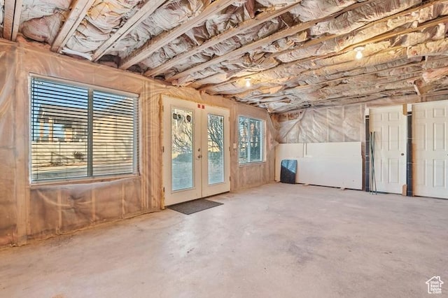 misc room featuring concrete flooring and french doors