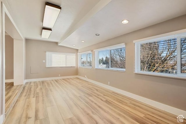 unfurnished room featuring light hardwood / wood-style floors