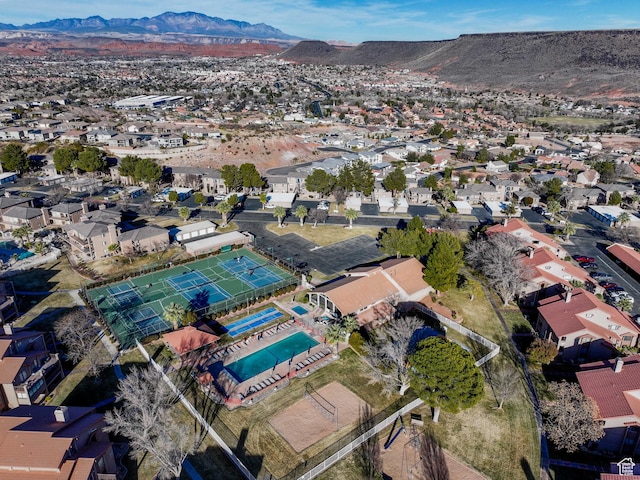 birds eye view of property with a mountain view