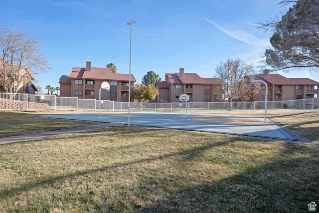 exterior space with a yard and basketball court