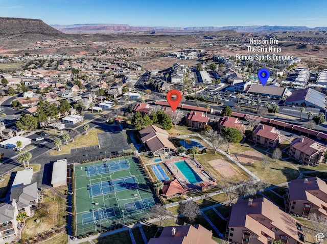 birds eye view of property featuring a mountain view