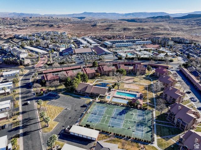 birds eye view of property with a mountain view