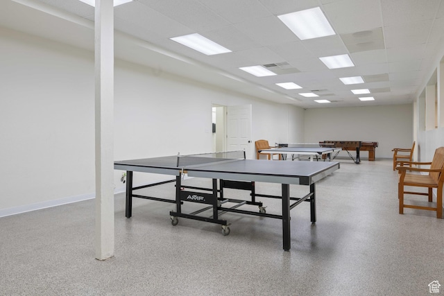 recreation room with a drop ceiling