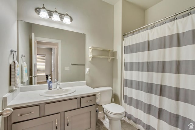 full bathroom with vanity, toilet, and curtained shower