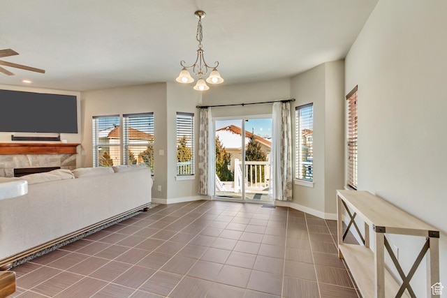 dining space featuring tile patterned flooring, a wealth of natural light, and baseboards