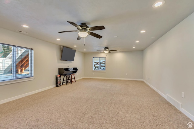 unfurnished room featuring visible vents, ceiling fan, light colored carpet, and recessed lighting