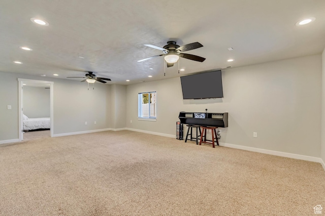 unfurnished living room featuring light colored carpet, ceiling fan, and recessed lighting