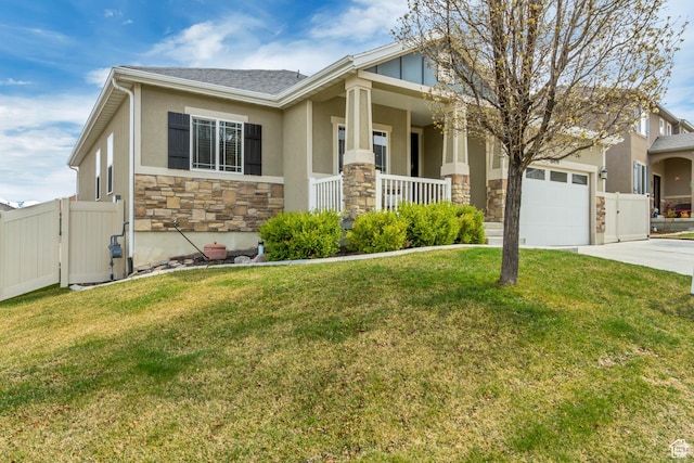 craftsman inspired home with covered porch, fence, driveway, stone siding, and an attached garage