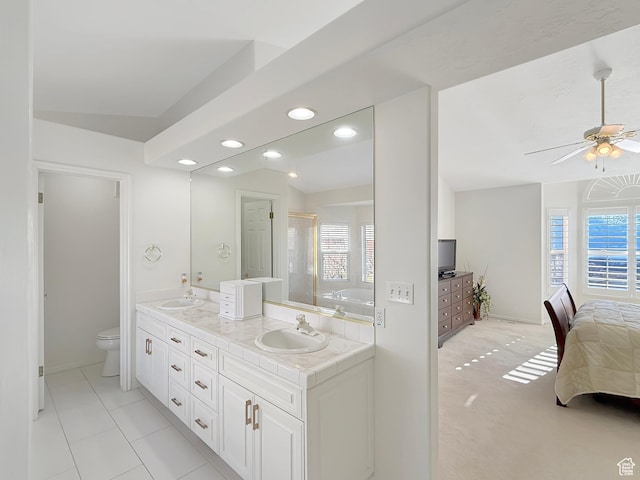 bathroom with vanity, a shower with shower door, ceiling fan, and toilet