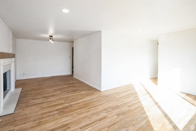 428 W 2650 N, Sunset, UT 84015 - unfurnished living room with light hardwood / wood-style floors