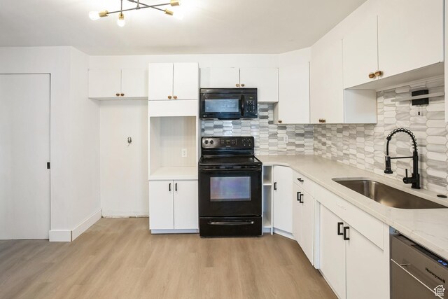 428 W 2650 N, Sunset, UT 84015 - kitchen with sink, white cabinetry, black appliances, light wood-type flooring, and backsplash