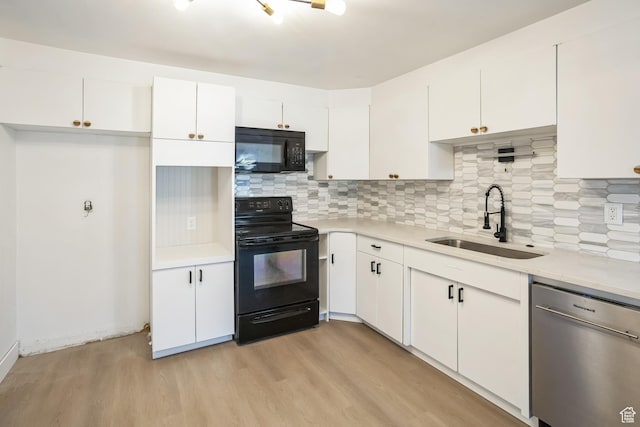 428 W 2650 N, Sunset, UT 84015 - kitchen with sink, black appliances, light hardwood / wood-style flooring, decorative backsplash, and white cabinets