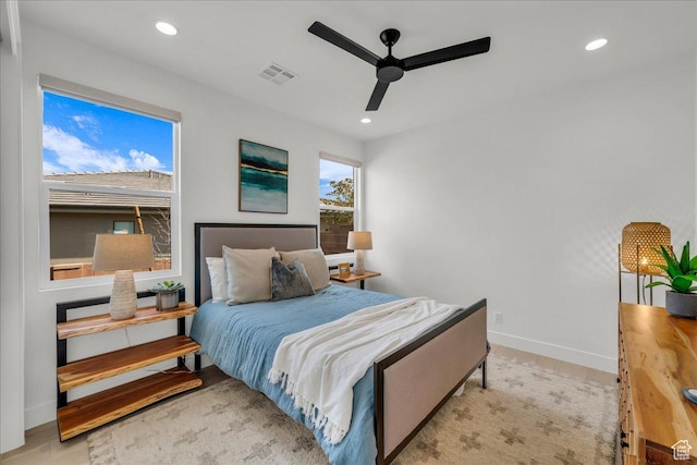 bedroom featuring light hardwood / wood-style flooring and ceiling fan