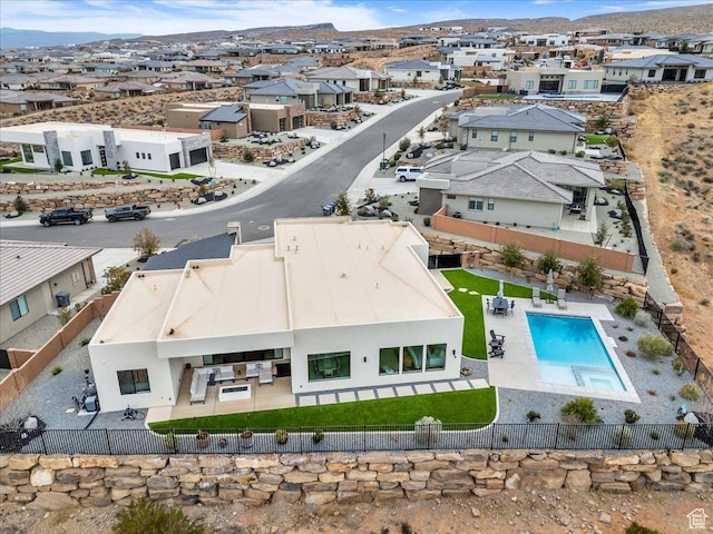birds eye view of property with a mountain view