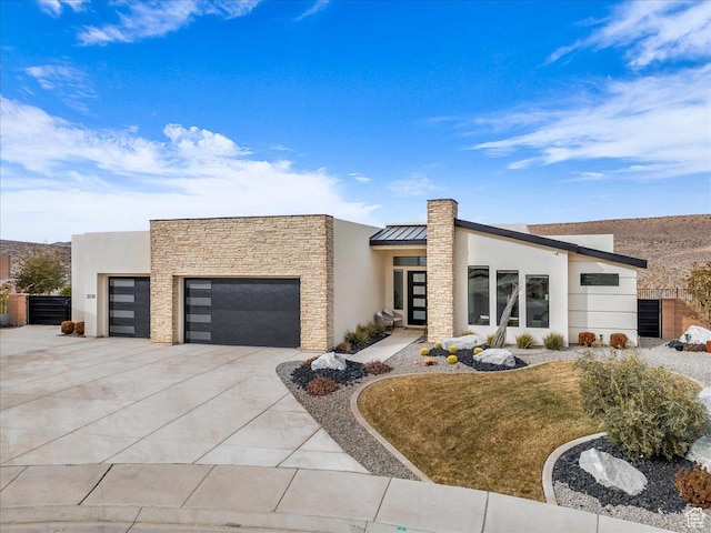 modern home with a garage and a front yard