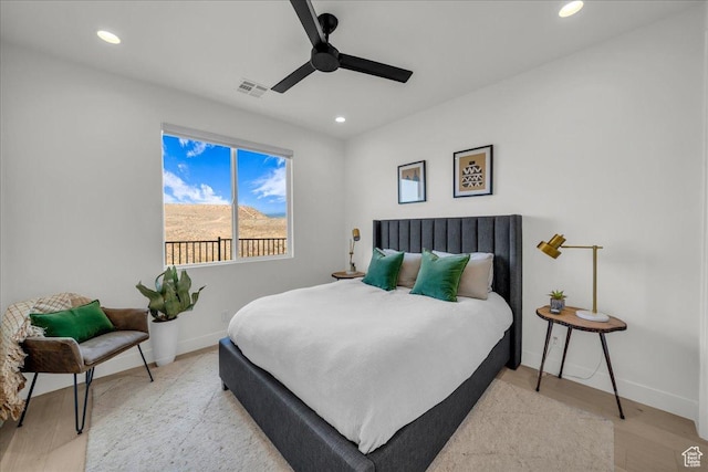 bedroom featuring ceiling fan and light wood-type flooring