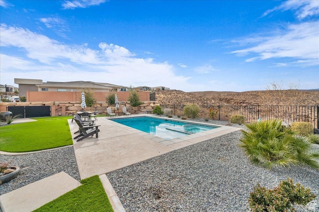 view of swimming pool featuring a patio area and a lawn