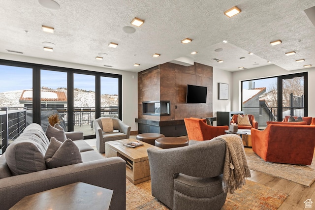 1271 Lowell Ave Unit B202, Park City, UT 84060 - living room with light hardwood / wood-style flooring and a textured ceiling