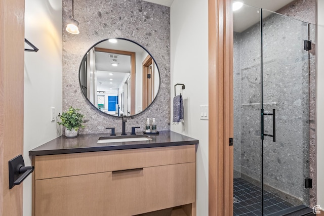 1271 Lowell Ave Unit B202, Park City, UT 84060 - bathroom with vanity, a shower with door, and decorative backsplash