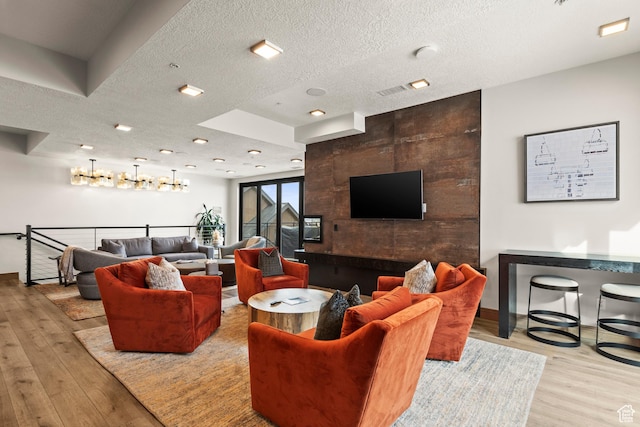 1271 Lowell Ave Unit B202, Park City, UT 84060 - living room featuring light hardwood / wood-style flooring and a textured ceiling