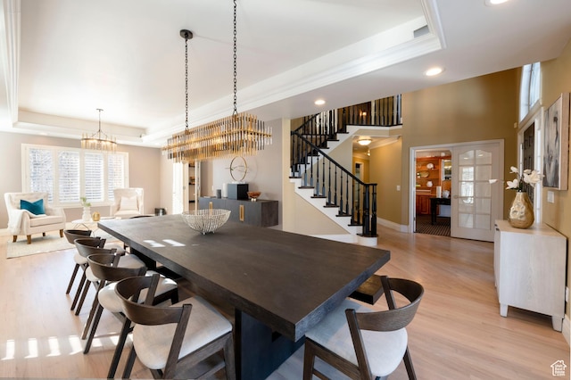 6658 S Caracol Cv, Cottonwood Heights, UT 84121 - dining room with a raised ceiling, recessed lighting, stairs, light wood-style floors, and a chandelier