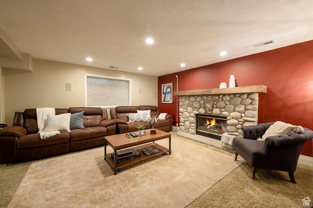 6658 S Caracol Cv, Cottonwood Heights, UT 84121 - living room featuring carpet floors, a stone fireplace, recessed lighting, and a textured ceiling