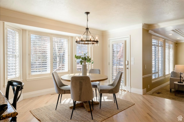 6658 S Caracol Cv, Cottonwood Heights, UT 84121 - dining area featuring a chandelier, crown molding, light wood-style floors, plenty of natural light, and baseboards