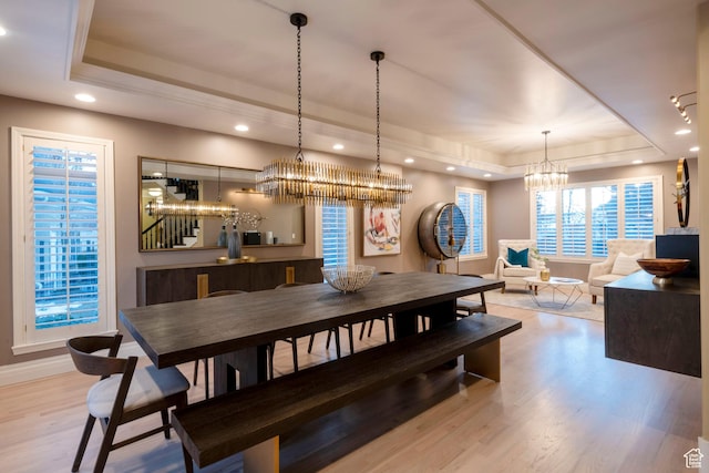 6658 S Caracol Cv, Cottonwood Heights, UT 84121 - dining space featuring a tray ceiling, a chandelier, wood finished floors, recessed lighting, and baseboards