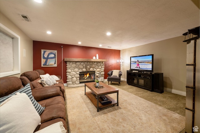 6658 S Caracol Cv, Cottonwood Heights, UT 84121 - living room featuring light colored carpet, recessed lighting, a stone fireplace, and baseboards