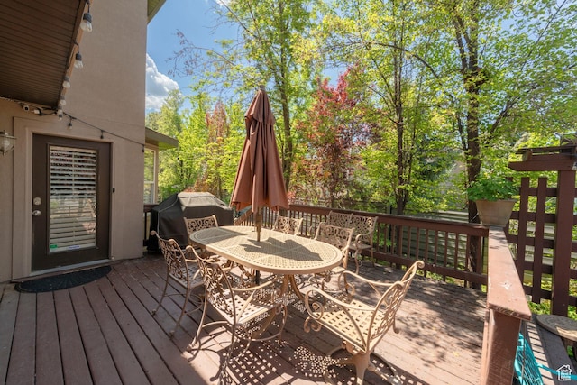 6658 S Caracol Cv, Cottonwood Heights, UT 84121 - deck with outdoor dining space and a grill