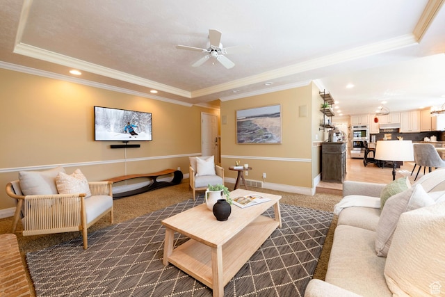 6658 S Caracol Cv, Cottonwood Heights, UT 84121 - living area featuring a tray ceiling, ceiling fan, recessed lighting, crown molding, and baseboards