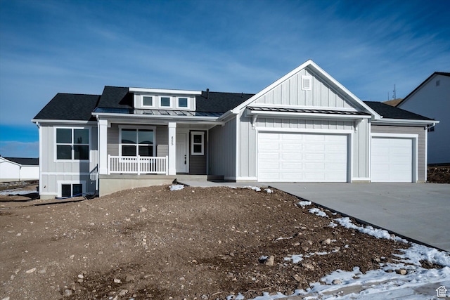 855 E 410 N Unit 157, Hyde Park, UT 84318 - view of front of house featuring a garage and covered porch