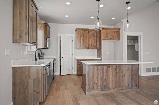 855 E 410 N Unit 157, Hyde Park, UT 84318 - kitchen with pendant lighting, a center island, and hardwood / wood-style floors