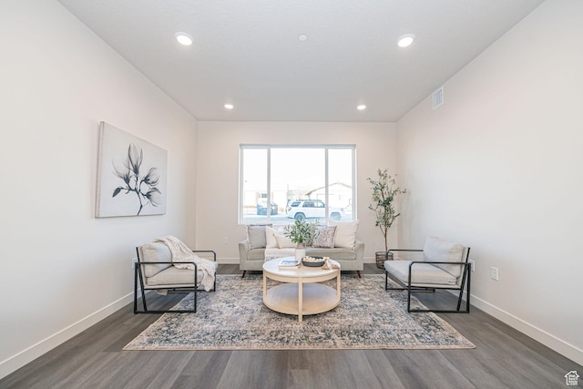 sitting room featuring recessed lighting, visible vents, baseboards, and wood finished floors