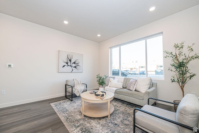 living room with recessed lighting, baseboards, and dark wood-style flooring