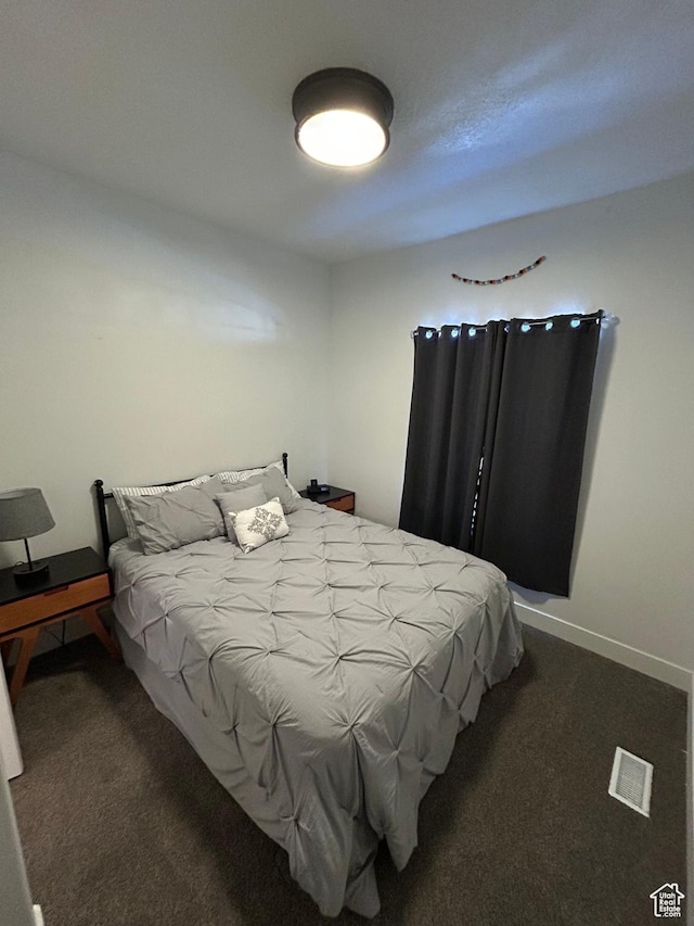 133 E Sailors Way, Garden City, UT 84028 - bedroom with baseboards, carpet flooring, and visible vents