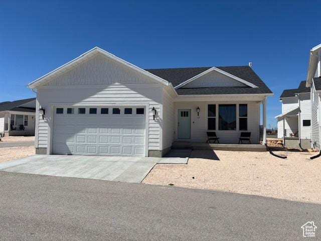 133 E Sailors Way, Garden City, UT 84028 - ranch-style home with concrete driveway and an attached garage