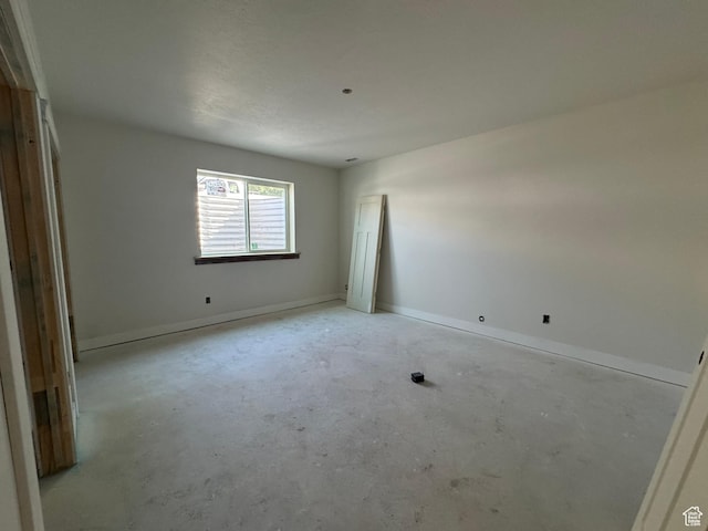 21 N 100 W Unit 3, Farmington, UT 84025 - spare room featuring unfinished concrete flooring and baseboards