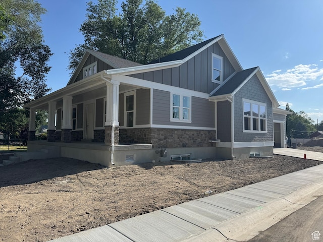 21 N 100 W Unit 3, Farmington, UT 84025 - view of front facade featuring board and batten siding, a porch, stone siding, and concrete driveway