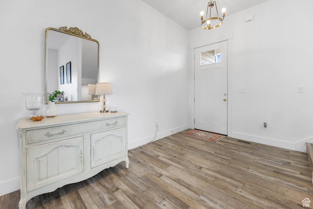 3932 W 2875 N, Plain City, UT 84404 - foyer entrance with a chandelier, light wood finished floors, and baseboards