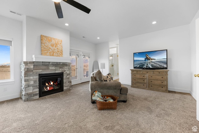 3932 W 2875 N, Plain City, UT 84404 - living area with carpet, ceiling fan, a stone fireplace, recessed lighting, and baseboards
