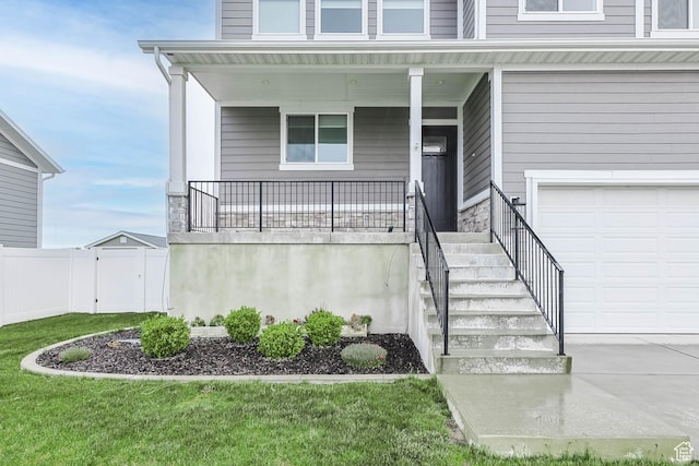 3932 W 2875 N, Plain City, UT 84404 - property entrance featuring an attached garage, a porch, concrete driveway, and stone siding
