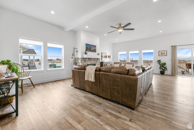 3932 W 2875 N, Plain City, UT 84404 - living room featuring a ceiling fan, light wood-style floors, a stone fireplace, recessed lighting, and baseboards