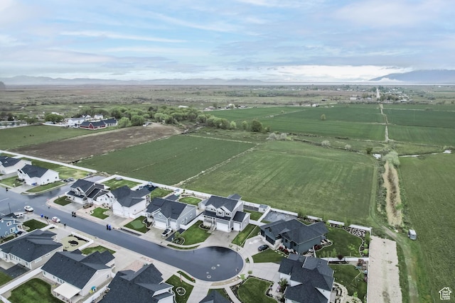 3932 W 2875 N, Plain City, UT 84404 - aerial overview of property's location with rural landscape, a mountain backdrop, and farmland