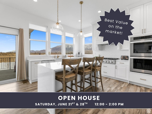 3932 W 2875 N, Plain City, UT 84404 - kitchen featuring appliances with stainless steel finishes, light countertops, tasteful backsplash, white cabinets, and recessed lighting