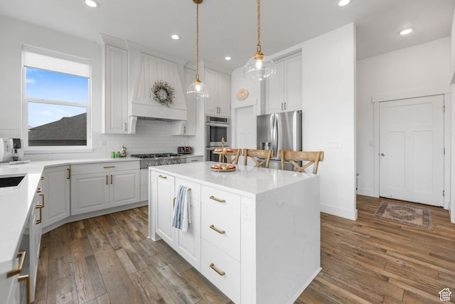 3932 W 2875 N, Plain City, UT 84404 - kitchen with appliances with stainless steel finishes, a kitchen island, backsplash, dark wood-style floors, and recessed lighting