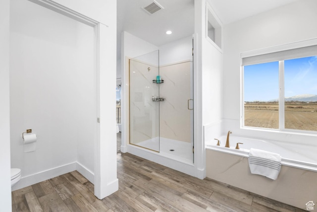 3932 W 2875 N, Plain City, UT 84404 - bathroom featuring a marble finish shower, wood finished floors, a bath, and toilet